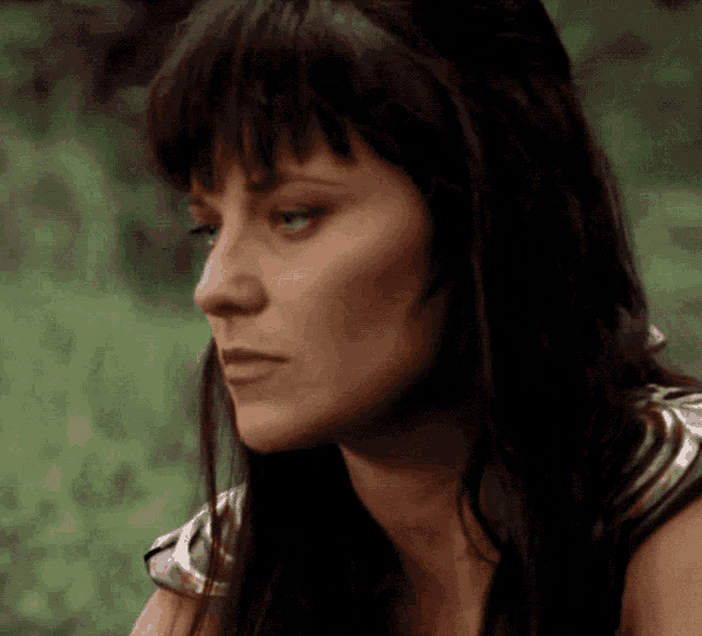 a close up of a woman 's face with her eyes closed