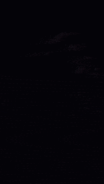 a hand is holding a glowing object with a circle around it
