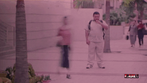 a blurry picture of people walking down a street with the word full in red