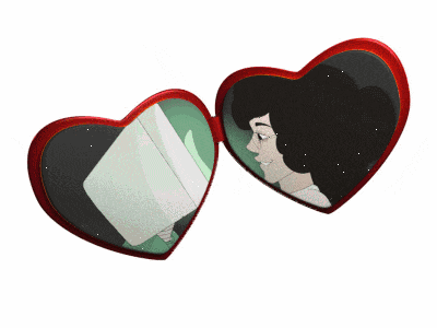 a heart shaped mirror has a picture of a woman on it