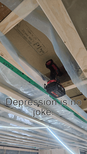 a drill is hanging from the ceiling with the words depression is no joke below it