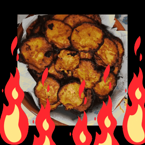 a picture of a plate of food with flames surrounding it