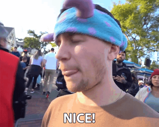 a man wearing a headband that says nice