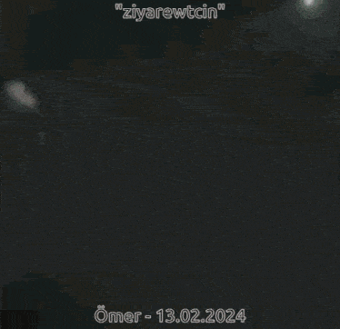 a blurred image of a person with the date 13.02.2024