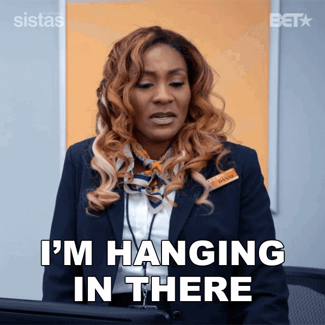 a woman says i 'm hanging in there