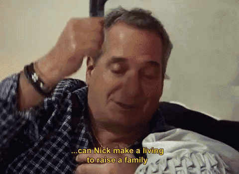 a man is sitting on a couch with the words " can nick make a living to raise a family " above him