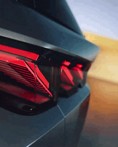 a close up of a car 's tail light which is red