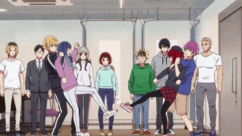a group of people are posing for a picture and one of them is holding another person 's leg