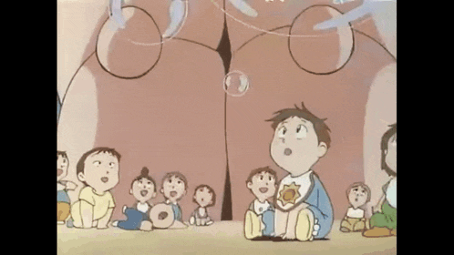 a group of children are sitting in front of a giant woman 's butt .