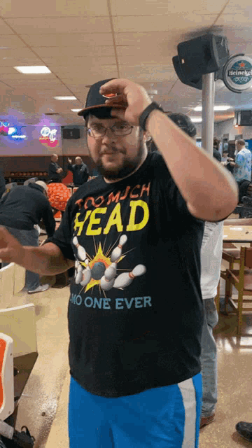 a man wearing a shirt that says too much head no one ever