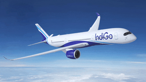 a blue and white indigo airplane is flying through the air