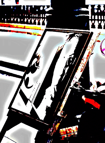 a painting of a woman 's face is on an easel in a black and white painting