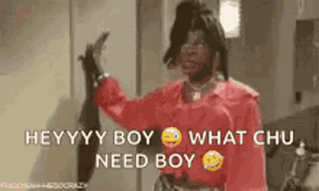 a man in a red shirt is holding a knife and saying `` hey , boy , what chu need boy '' .