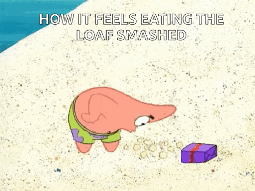 patrick star from spongebob squarepants is eating a loaf of bread on a beach .