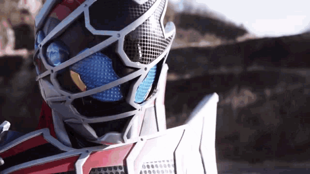 a close up of a person wearing a helmet and a shield
