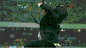 a man in a suit and tie is jumping in the air in front of a crowd
