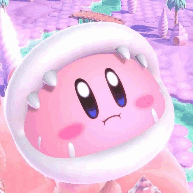 a close up of a pink cartoon character with a large mouth