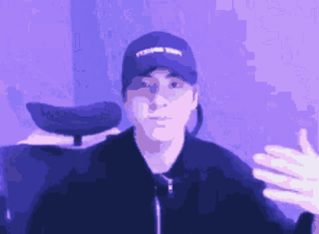 a man wearing a blue hat that says ' young thug '