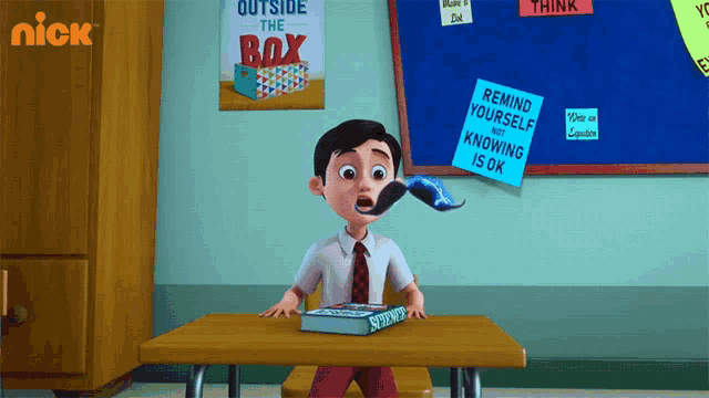 a boy with a mustache is sitting at a desk with a book and a sign that says outside the box