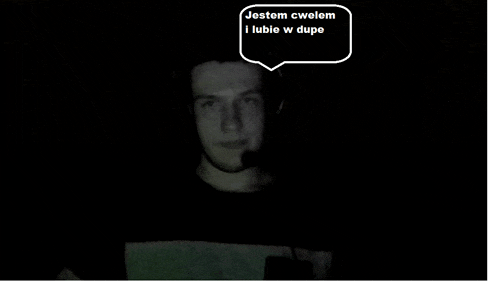 a man in a dark room with a speech bubble that says jestem cwolem i lubie w dupe