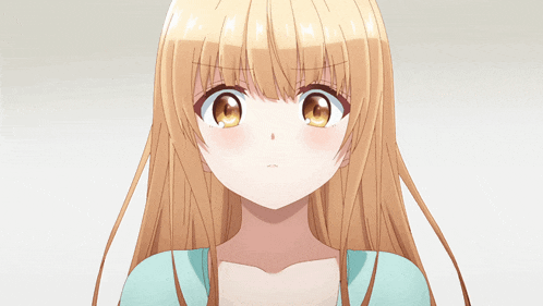 a close up of a girl 's face with blonde hair and brown eyes