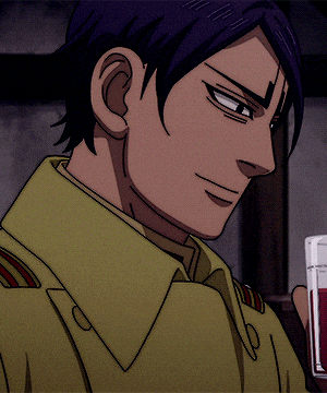a man in a yellow shirt is holding a glass