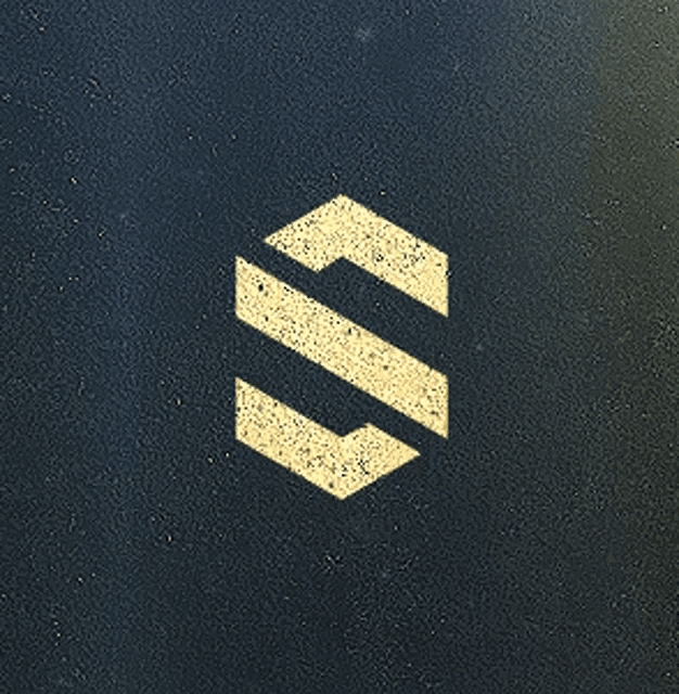 the letter s is painted on a dark surface