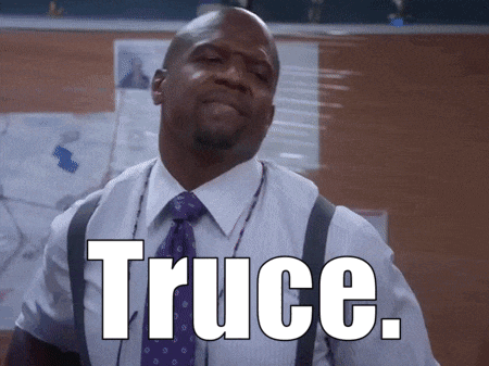 a man in a white shirt and purple tie has the word truce written on his chest