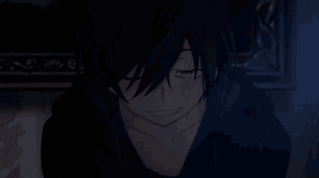 a close up of a person in a dark room