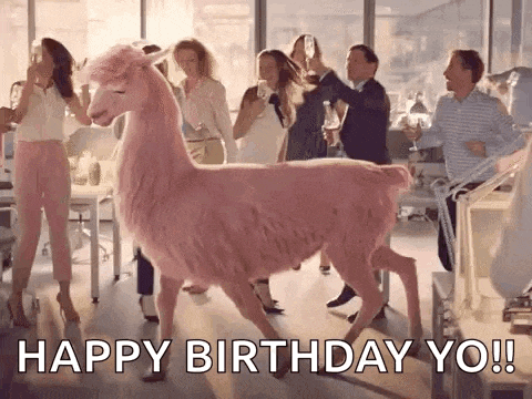 a pink llama is walking in front of a group of people holding glasses of wine .