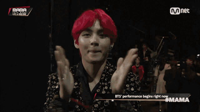 a man with red hair is on a mnet video