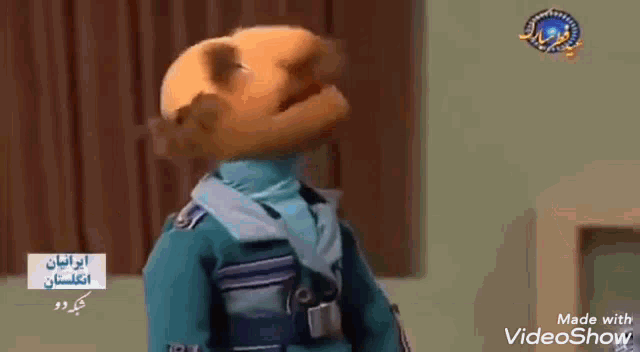 a cartoon character wearing a medal around his neck is standing in a room .