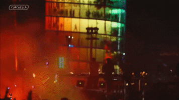 a blurred image of a concert with the word coachella on the bottom right