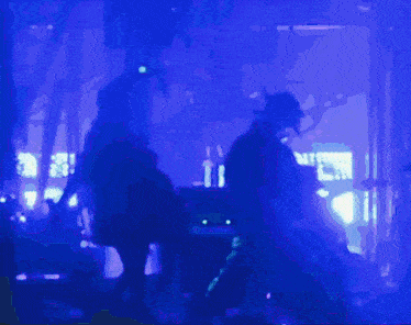 a blurry picture of a person in a dark room