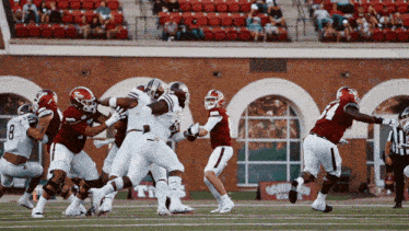 a football game is being played in front of a sign that says texas on it