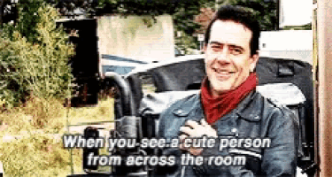 a man with a scarf around his neck says when you see a cute person from across the room .