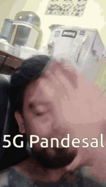 a man with a beard is sitting in a chair with the words 5g pandesal above his head