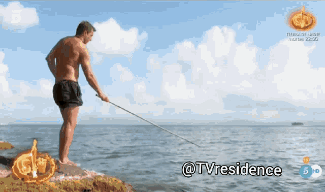 a shirtless man is fishing in the ocean with the hashtag @tvresidence on the bottom