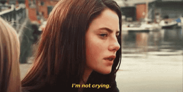 a close up of a woman 's face with the words i 'm not crying above her