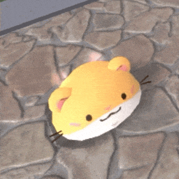 a yellow and white stuffed animal is sitting on a stone walkway