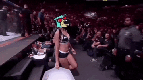 a woman in a bikini with a cartoon dog on her head