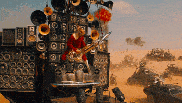 a man playing a saxophone on top of a car with a lot of speakers on it