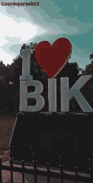 a sign that says " i love bik " with a heart in the middle