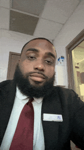 a man with a beard wearing a name tag that says " chris "