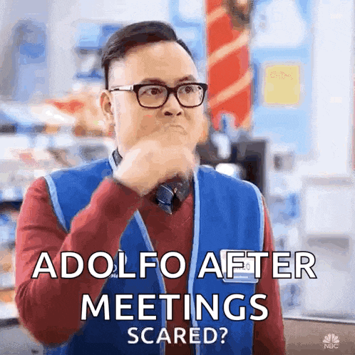 a man wearing glasses and a blue vest is saying adolfo after meetings scared ?