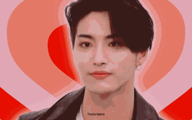 a close up of a man 's face with a heart in the background and the words hwaviews on the bottom
