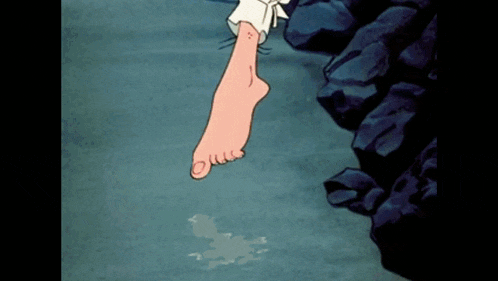 a cartoon character 's foot is hanging from a cliff