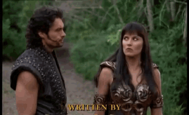 a man and a woman are standing next to each other and the woman is saying don 't get jealous