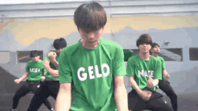 a group of young men wearing green shirts that say gelo