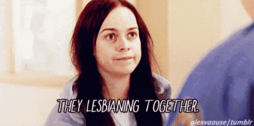 a woman is talking to a man and they are lesbianing together